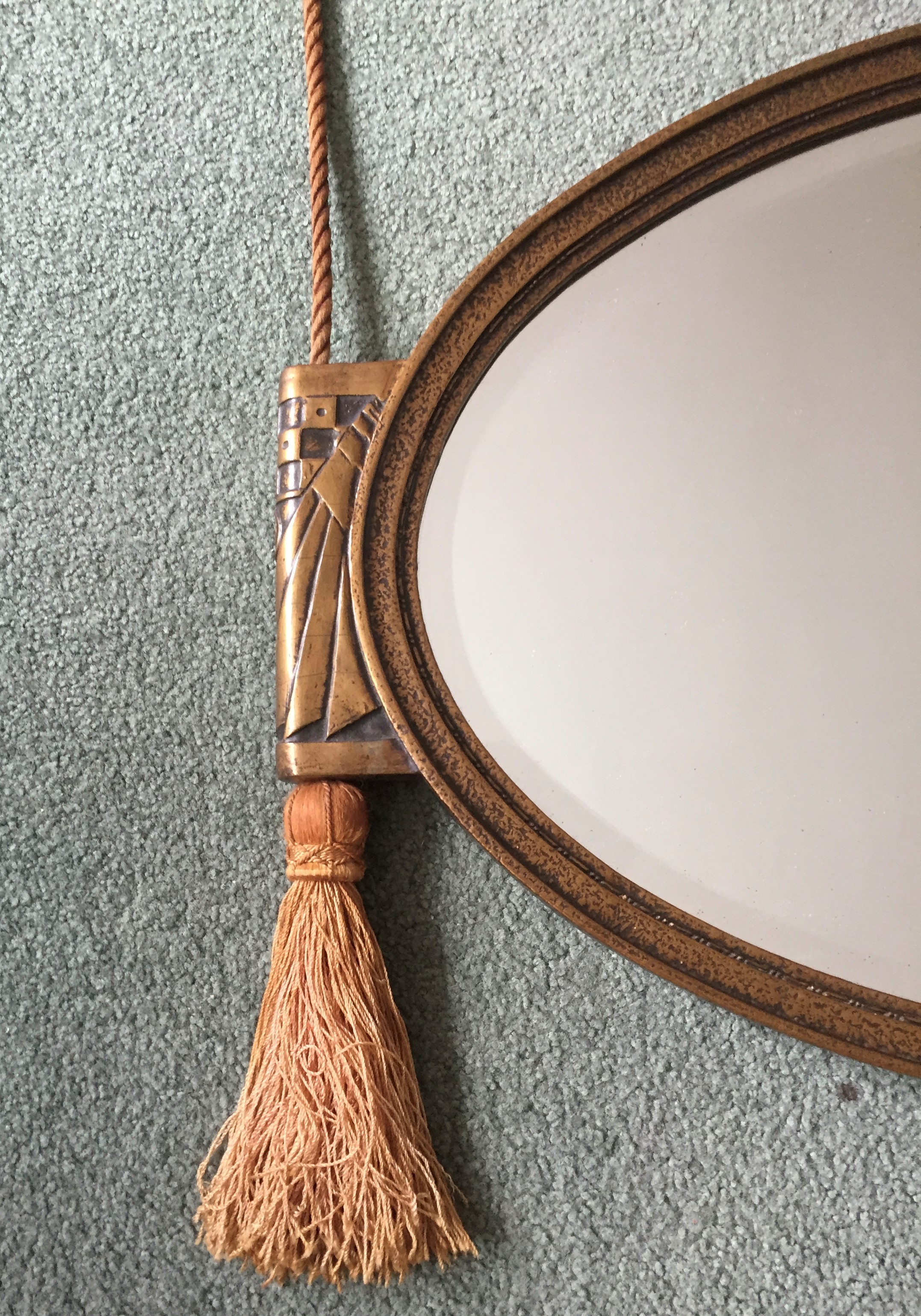 An Art Deco style oval wall mirror, width 74cm, height 43cm